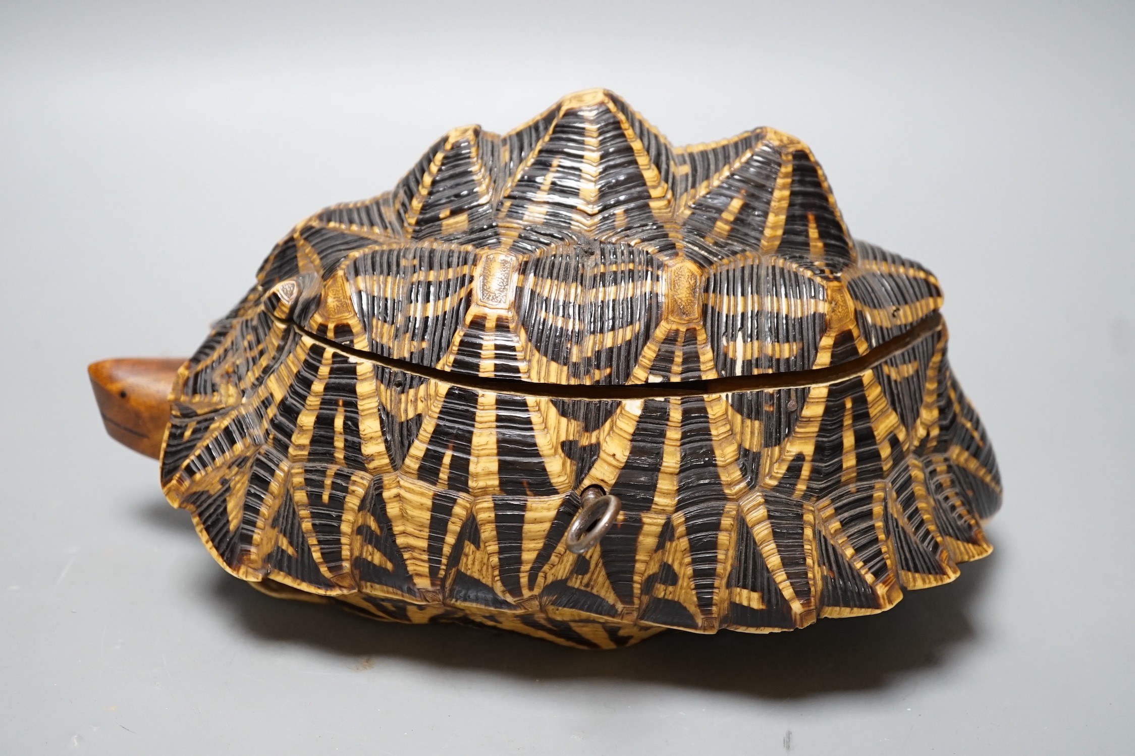 Early 20th century Ceylonese tortoise trinket box, with marquetry inlaid interior, 24.5 cm wide